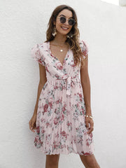Blush pink floral pleated dress with ruffle sleeves and tie waist