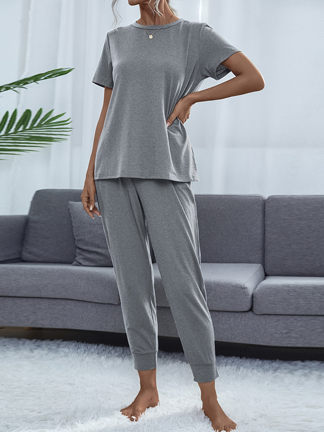 Relaxed-fit charcoal tee and jogger set with crew neck and cuffed ankles.