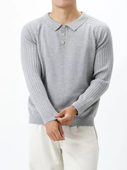Light gray cotton knit polo shirt with ribbed sleeves and button placket.