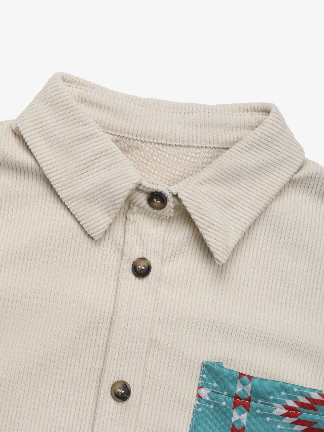 Corduroy shacket in Dust Storm with Aztec print pocket detail and button closure.