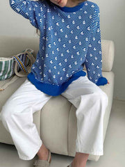 Royal blue knit sweater with allover white sailboat pattern and crewneck.
