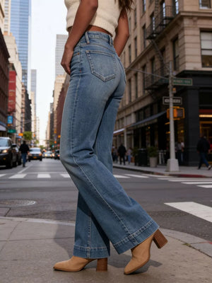 Elevated high-waisted flare jeans in light wash denim with buttoned closure and wide leg.