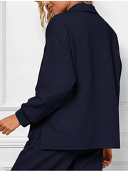 Navy blue V-neck textured lounge set with diagonal pattern.