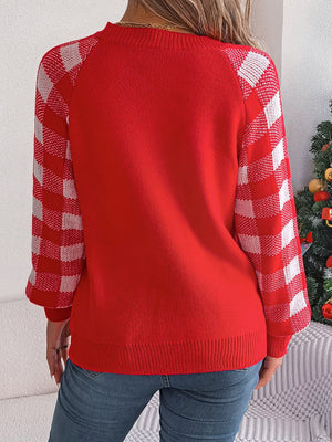 Red acrylic sweater with white gingham raglan sleeves.