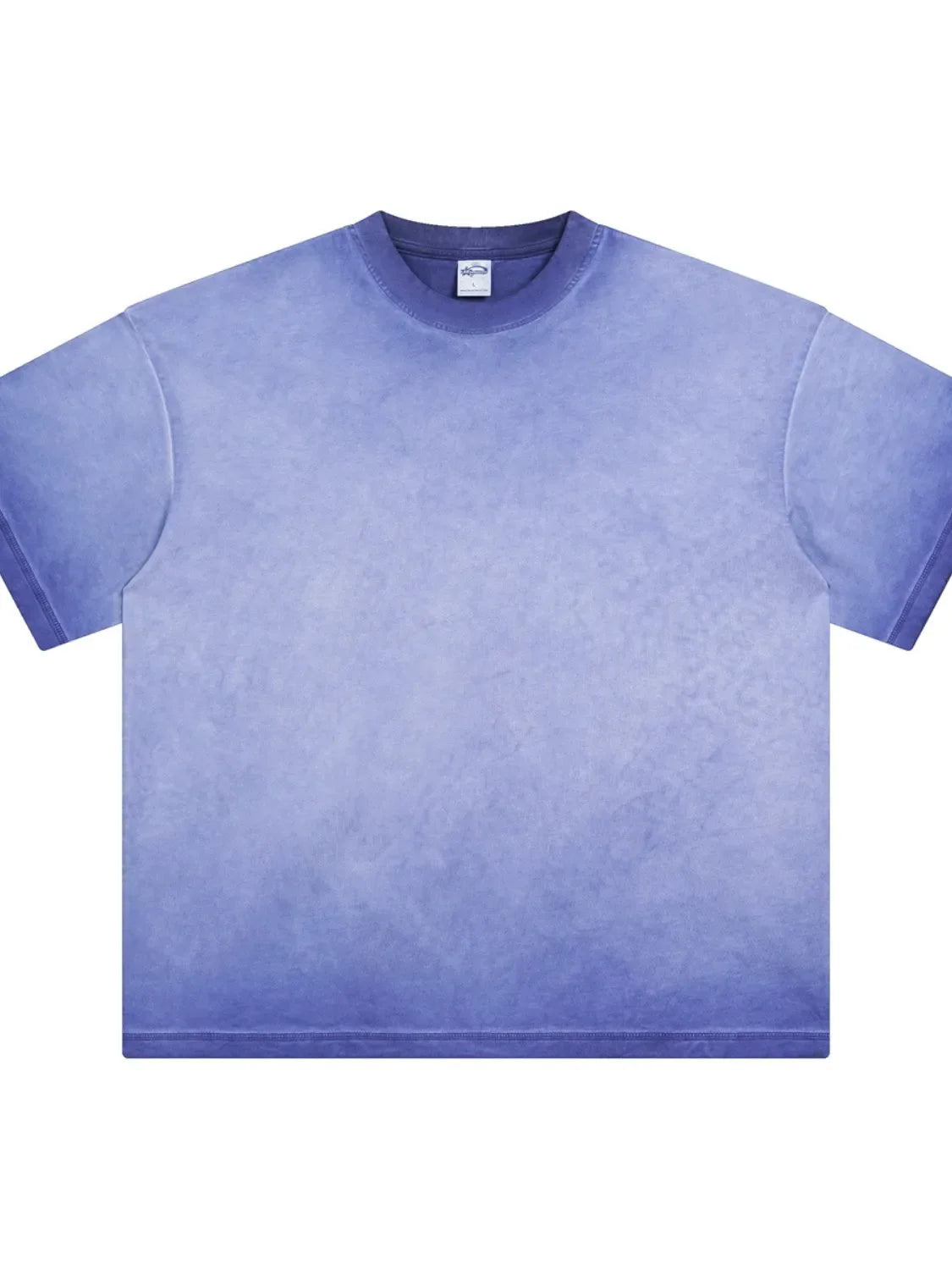 Pigment-dyed oversized tee in Light Indigo with a faded gradient effect and crew neck.