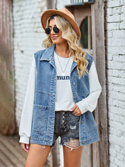 Light blue denim oversized utility vest with button front and chest pockets.