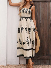 Bohemian smocked maxi dress with tiered skirt, black print on cream, square neck, spaghetti straps.