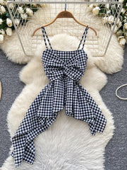 Black and white gingham cami top with a twisted knot front and asymmetrical hem.