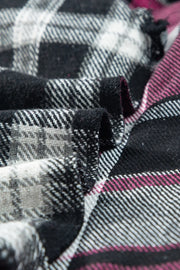 Colorblock plaid shacket in black, white, grey, and pink.