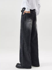 Men's wide-leg wash denim jeans in black with a relaxed fit.