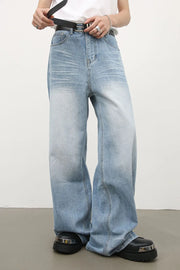 Light blue baggy denim palazzo jeans with a faded wash and wide leg.