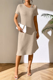 Tan ribbed midi dress with short sleeves and asymmetric shoulder detail.