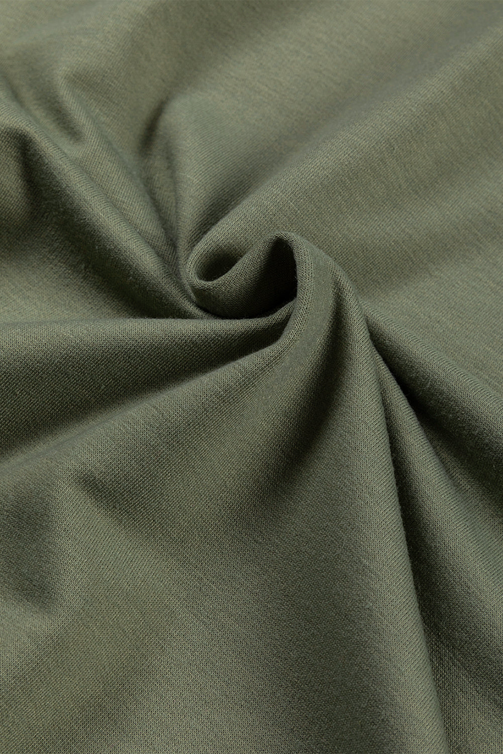 Army green tunic fabric with a textured weave and soft drape.