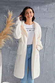 Cream plush hooded duster with thumbhole cuffs and pockets