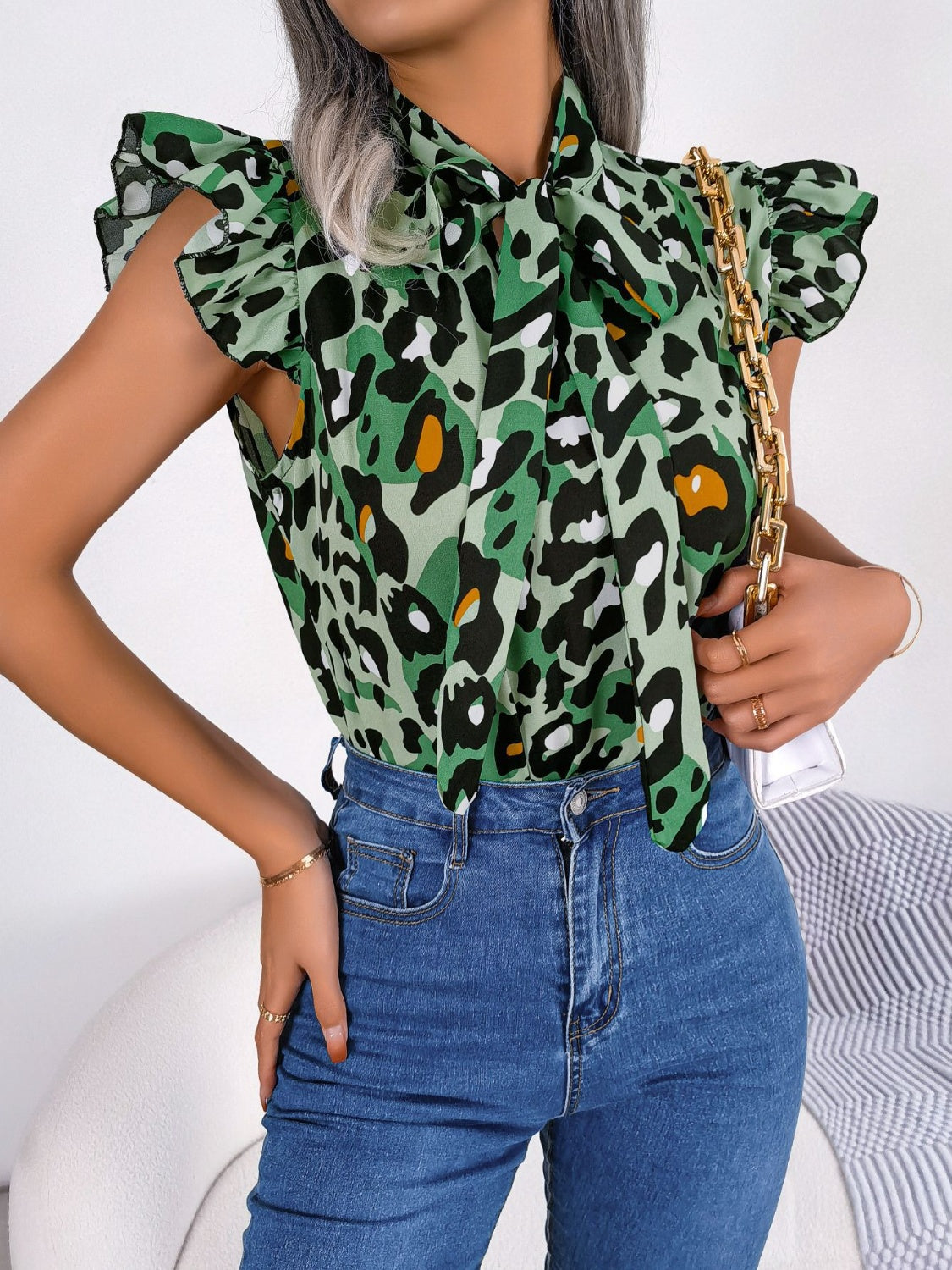 Green leopard print blouse with ruffled sleeves and pussybow tie neck