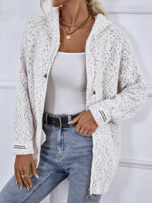 Textured knit zip-up cardigan in white with speckles and logo detail on sleeve.