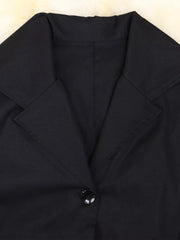Black midi dress with lapel collar, button detail, and cuffed sleeves.
