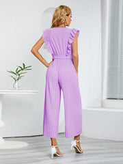 Pink purple pleated ruffle wrap jumpsuit with belt and wide legs.