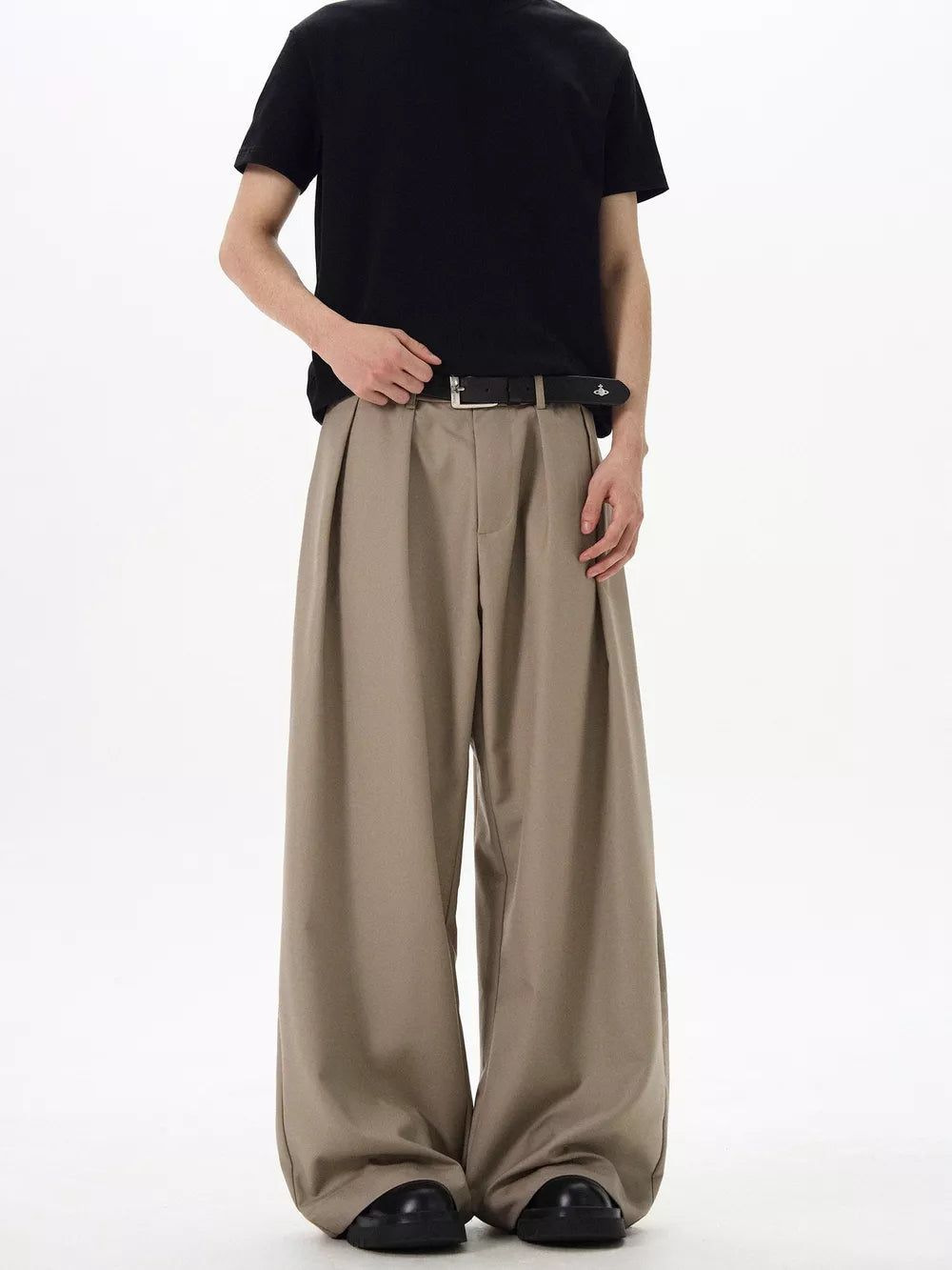 Khaki relaxed fit sweatpants with front pleats and a wide leg.