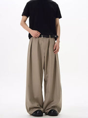 Khaki relaxed fit sweatpants with front pleats and a wide leg.