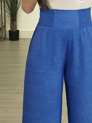 CurveFlare High Rise Wide Leg Trousers in Royal Blue with smocked waistband detail.