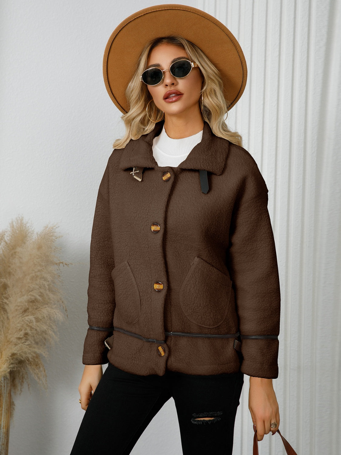Chocolate teddy textured jacket with leatherette trim and button closure.