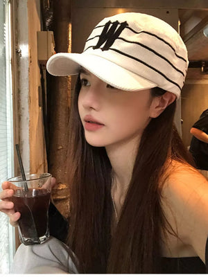 White cotton baseball cap with black stripes and embroidered 'W