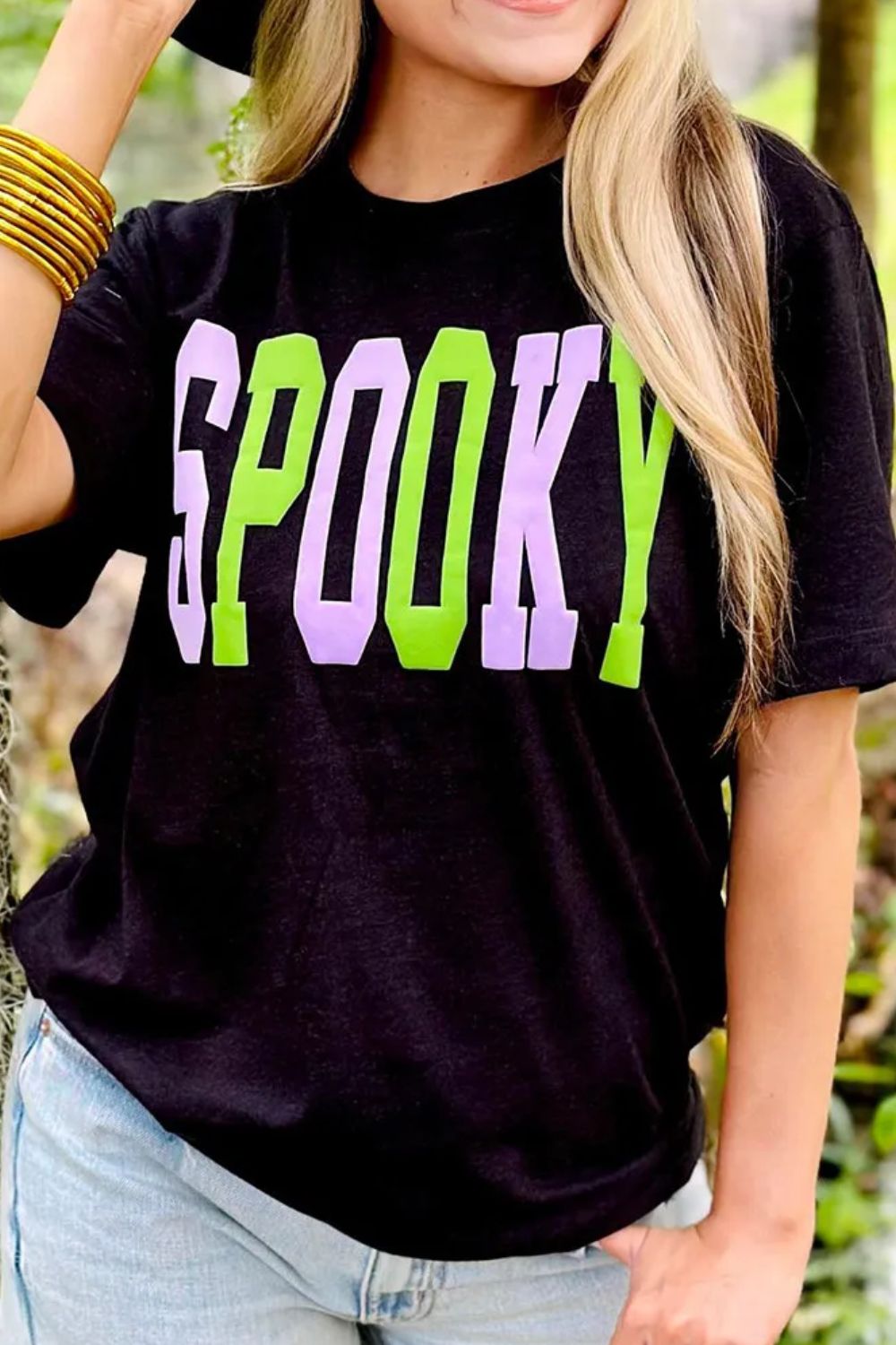 Black t-shirt with green and purple SPOOKY graphic text