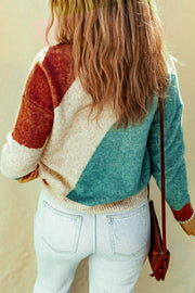 Geometric colorblock knit sweater with multicolor blocks and a crew neck.