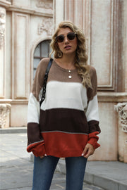 Acrylic crewneck sweater with horizontal color blocks in brown, white, dark gray, and rust.