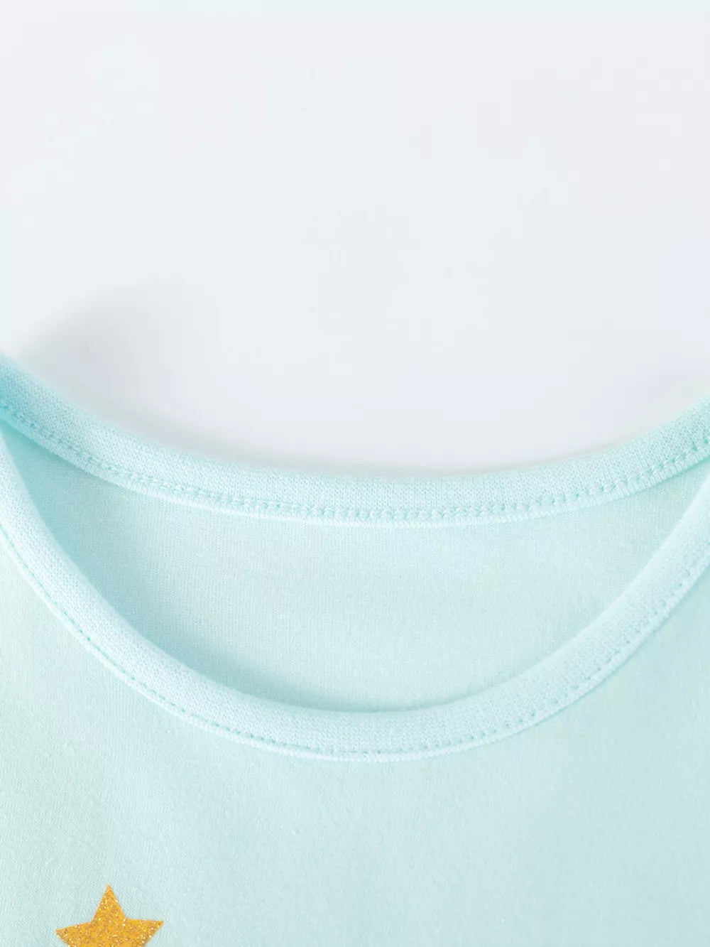 Light blue cotton toddler dress with gold star detail and light blue trim neckline.