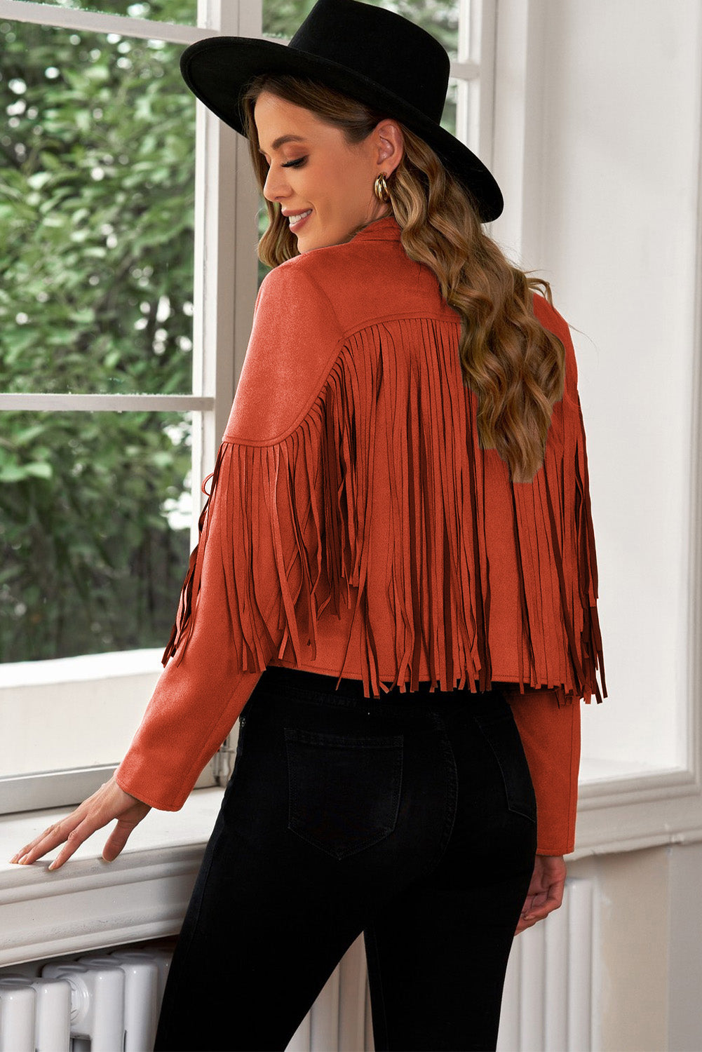 Fringed suede cropped western jacket in rust with long sleeves and fringe detail.