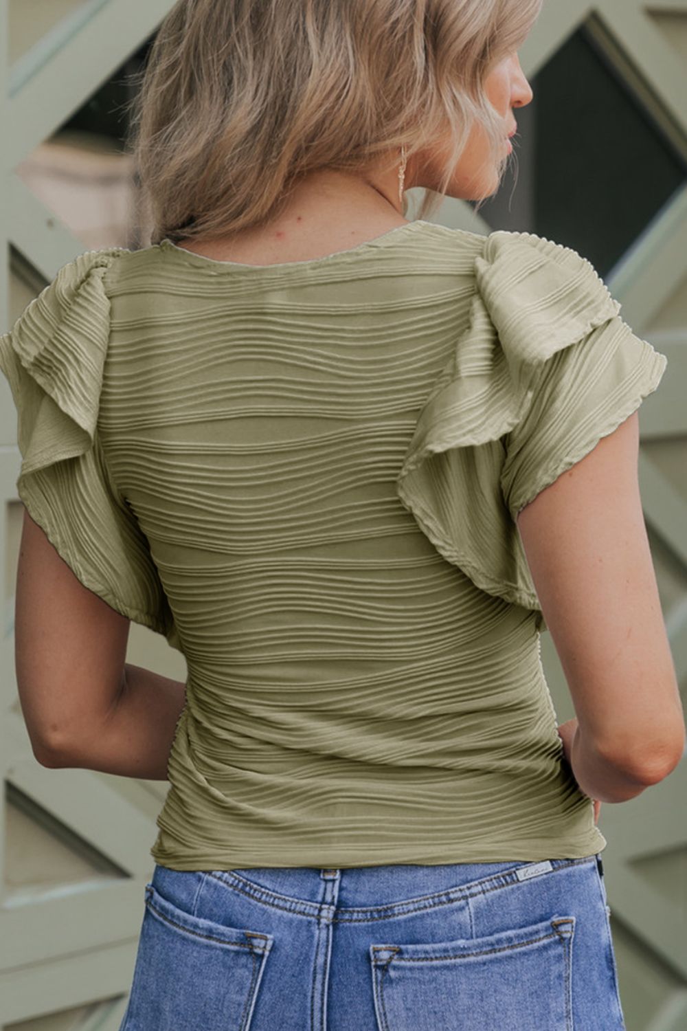 Textured ruffle sleeve bodysuit in Moss with horizontal ribbed fabric and a scoop neckline.