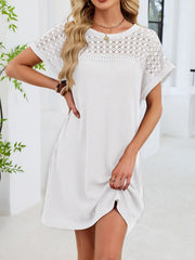 White t-shirt dress with short sleeves and sheer lace yoke detail, above knee length.