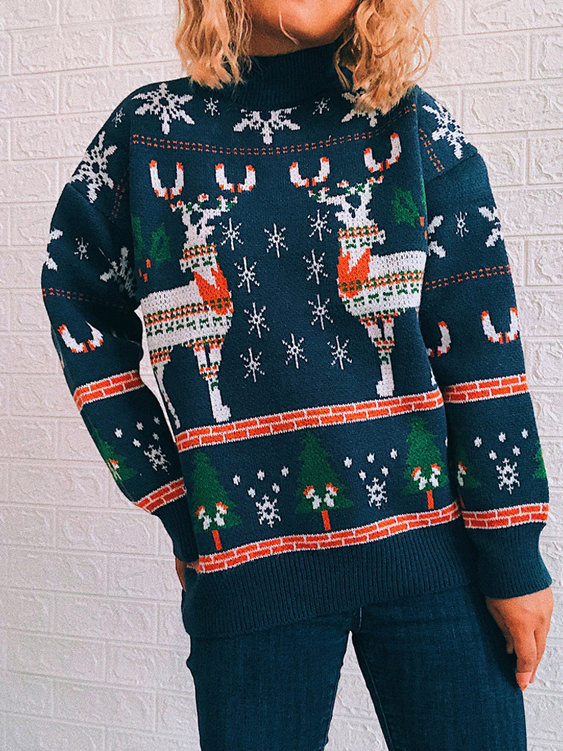 Peacock blue acrylic turtleneck sweater with reindeer, snowflake, and Christmas tree intarsia pattern.