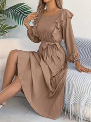 Khaki midi dress with ruffles, tie waist, and pleated skirt.