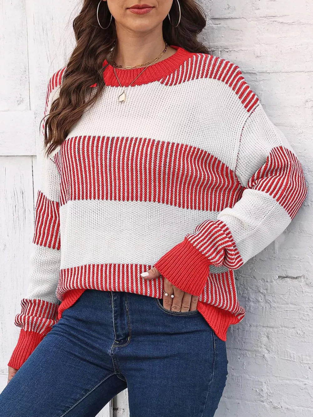 Cozy striped knit sweater with crew neck and cuffed sleeves in red and white acrylic.