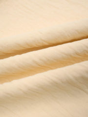 Pastel yellow maternity pants fabric detail with soft texture