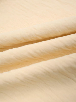 Pastel yellow maternity pants fabric detail with soft texture