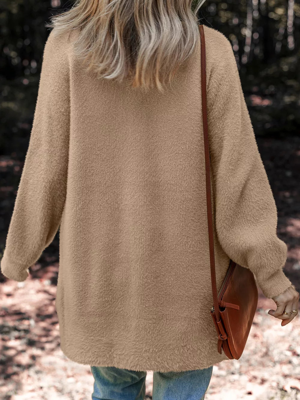 Fuzzy camel cardigan with pockets and long sleeves, worn with a crossbody bag.