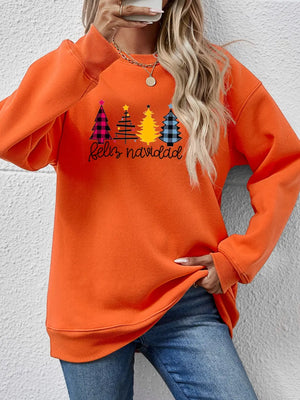 Orange crewneck sweatshirt with Feliz Navidad graphic featuring plaid and yellow Christmas trees.