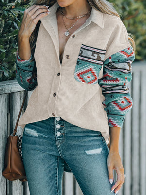 Corduroy shacket in Dust Storm with Aztec print sleeves and chest pocket, collared, buttoned front.