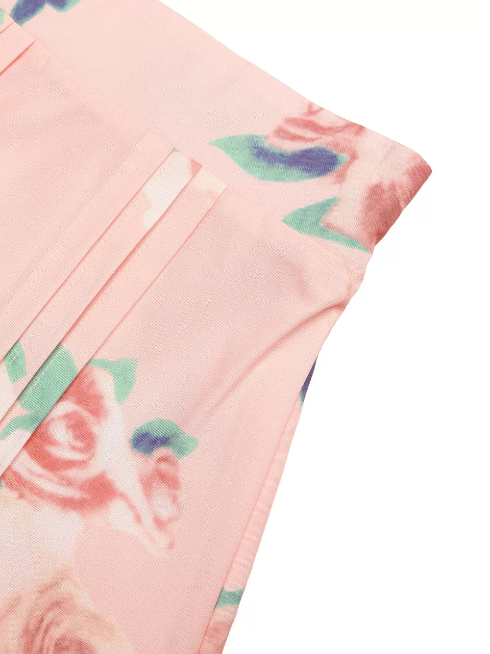 Pink floral print midi skirt with pleated detail and structured shoulder top detail.