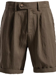 Classic pleated chino shorts in coffee with practical pockets and cuffed hems.