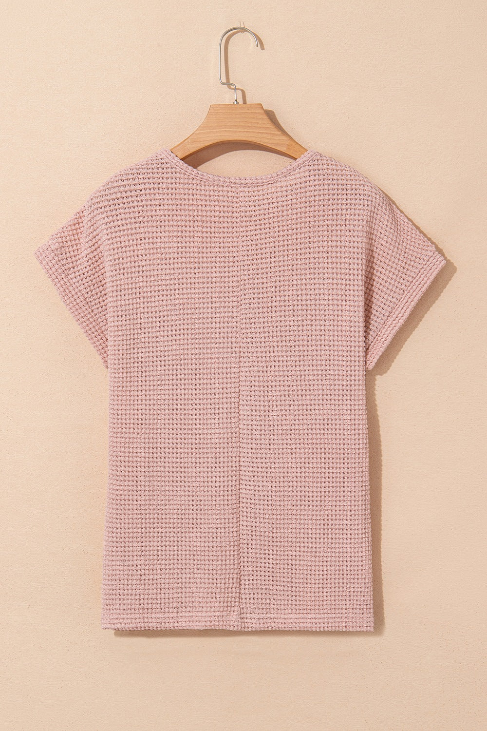 Dusty pink waffle knit top with short sleeves and a crew neck.