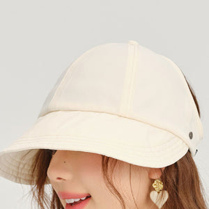 Beige visor hat with decorative stitching and adjustable strap detail