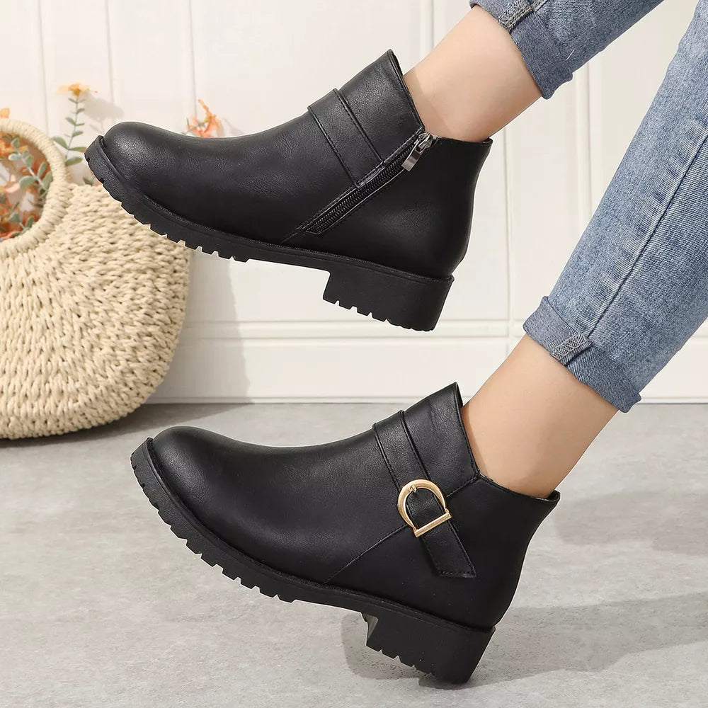 Black ankle boots with buckle detail and side zipper