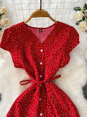 Red polka dot maxi dress with button front and tie belt.