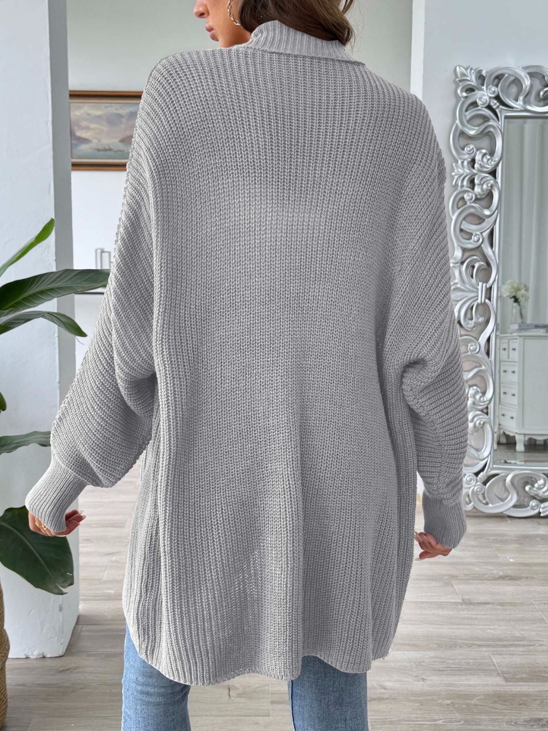 Gray ribbed knit cocoon cardigan with a relaxed fit and balloon sleeves.