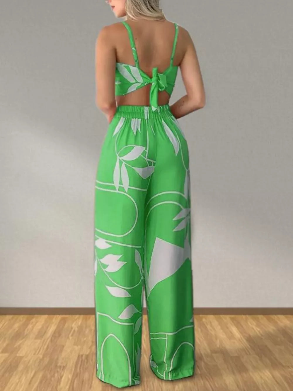 Light green tropical print crop top and wide-leg pants set with tie back detail.